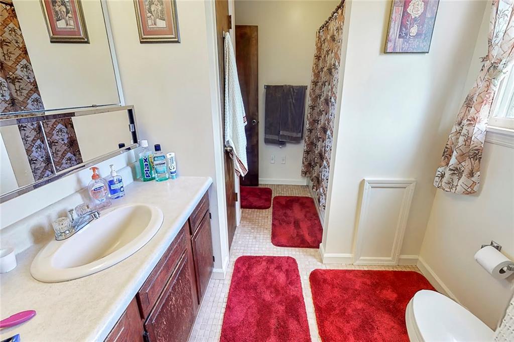 504 North Eighty Eight Road Carmichaels, PA 15320 - Photo 23 of 25 a bathroom with a sink vanity mirror and toilet