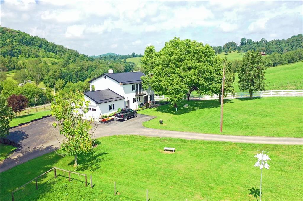 504 North Eighty Eight Road Carmichaels, PA 15320 - Photo 5 of 25 a view of a garden with a bench