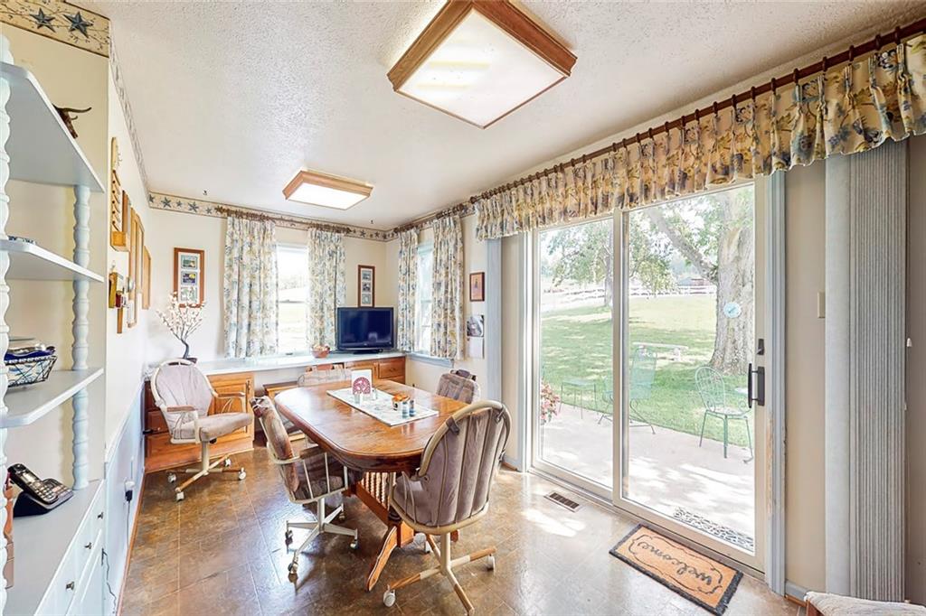 504 North Eighty Eight Road Carmichaels, PA 15320 - Photo 9 of 25 a view of a dining room with furniture window and wooden floor