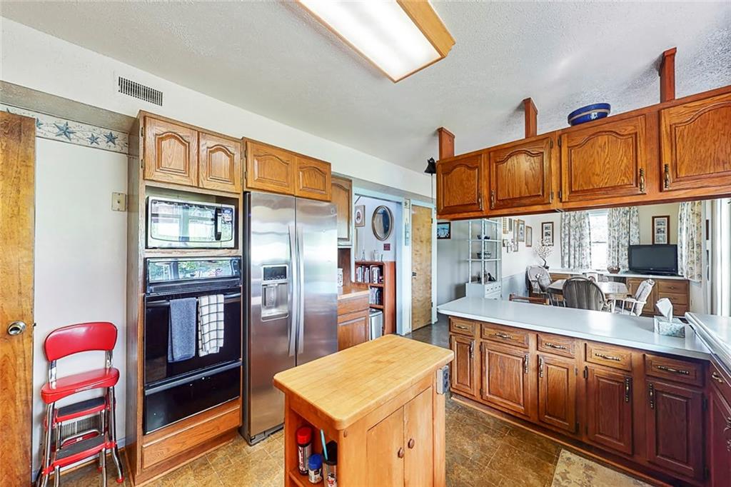 504 North Eighty Eight Road Carmichaels, PA 15320 - Photo 10 of 25 a kitchen with stainless steel appliances granite countertop a refrigerator and a sink