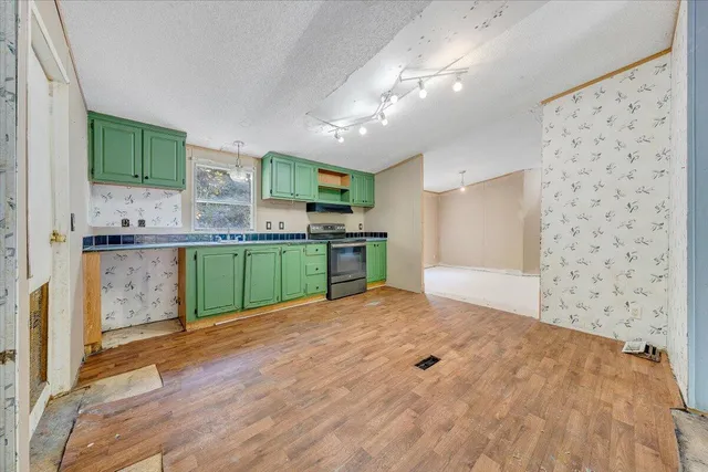 a kitchen with stainless steel appliances a sink and a stove