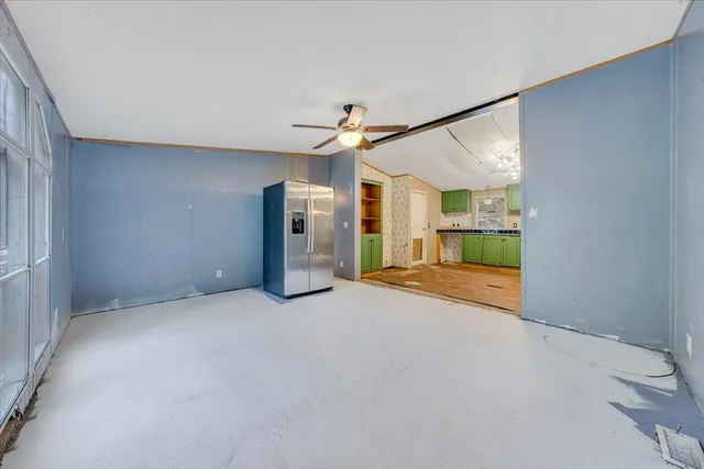 a view of a big room with closet and a large window