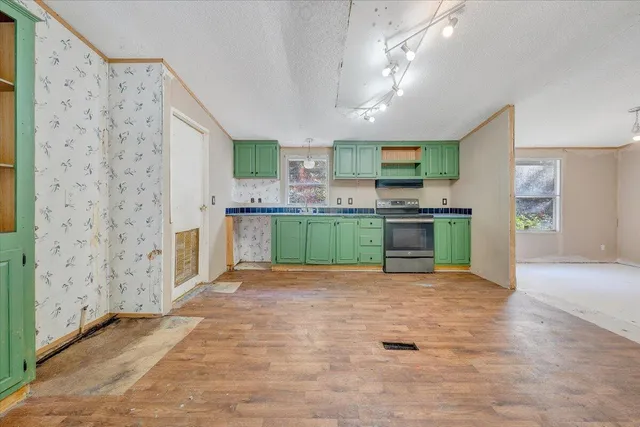 a view interior of a house with kitchen view and a window