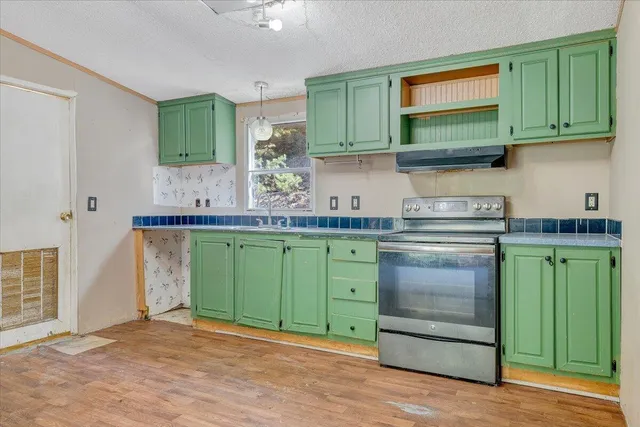 a kitchen with a sink and cabinets