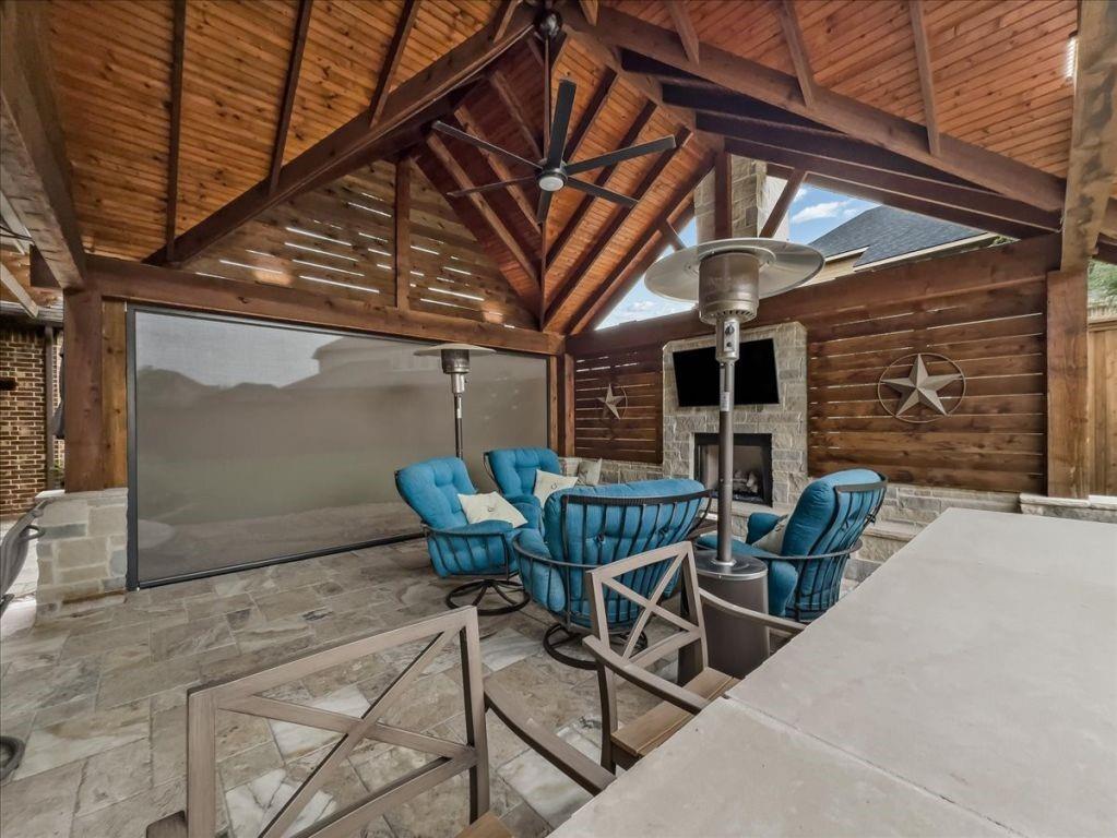 2832 Mona Vale Road Trophy Club, TX 76262 - Photo 12 of 37 a patio with table and chairs and potted plants