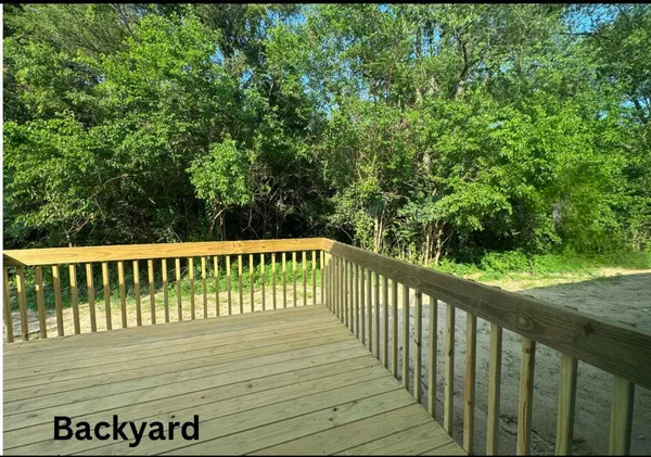a view of balcony with wooden floor
