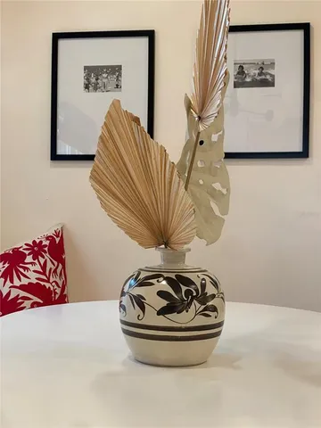 a view of a hallway to a livingroom with furniture