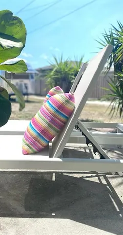 a view of a patio with a table and chairs and potted plants