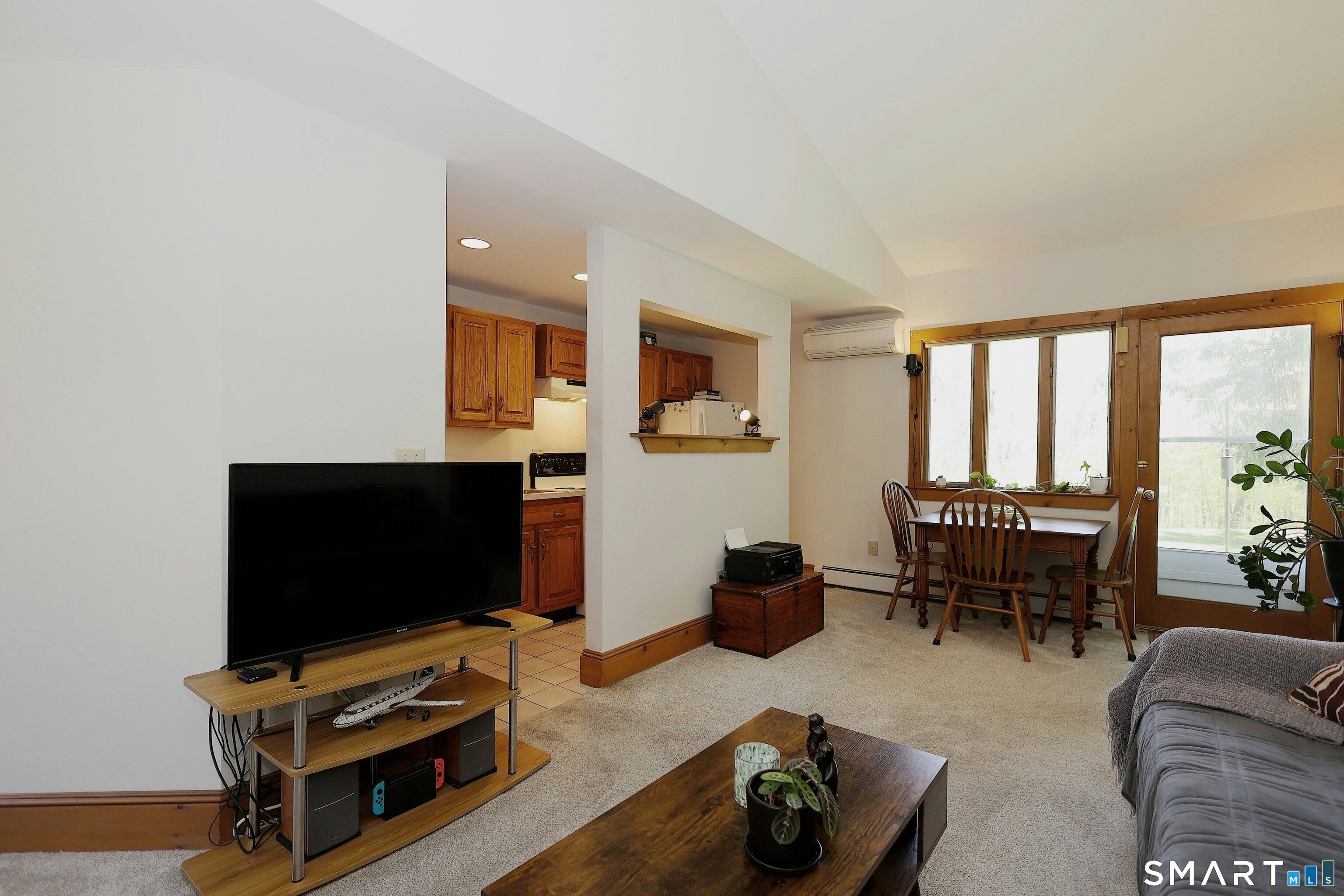 68 Bloomer Road Ridgefield, CT 06877 - Photo 35 of 40 a living room with furniture a flat screen tv and a window