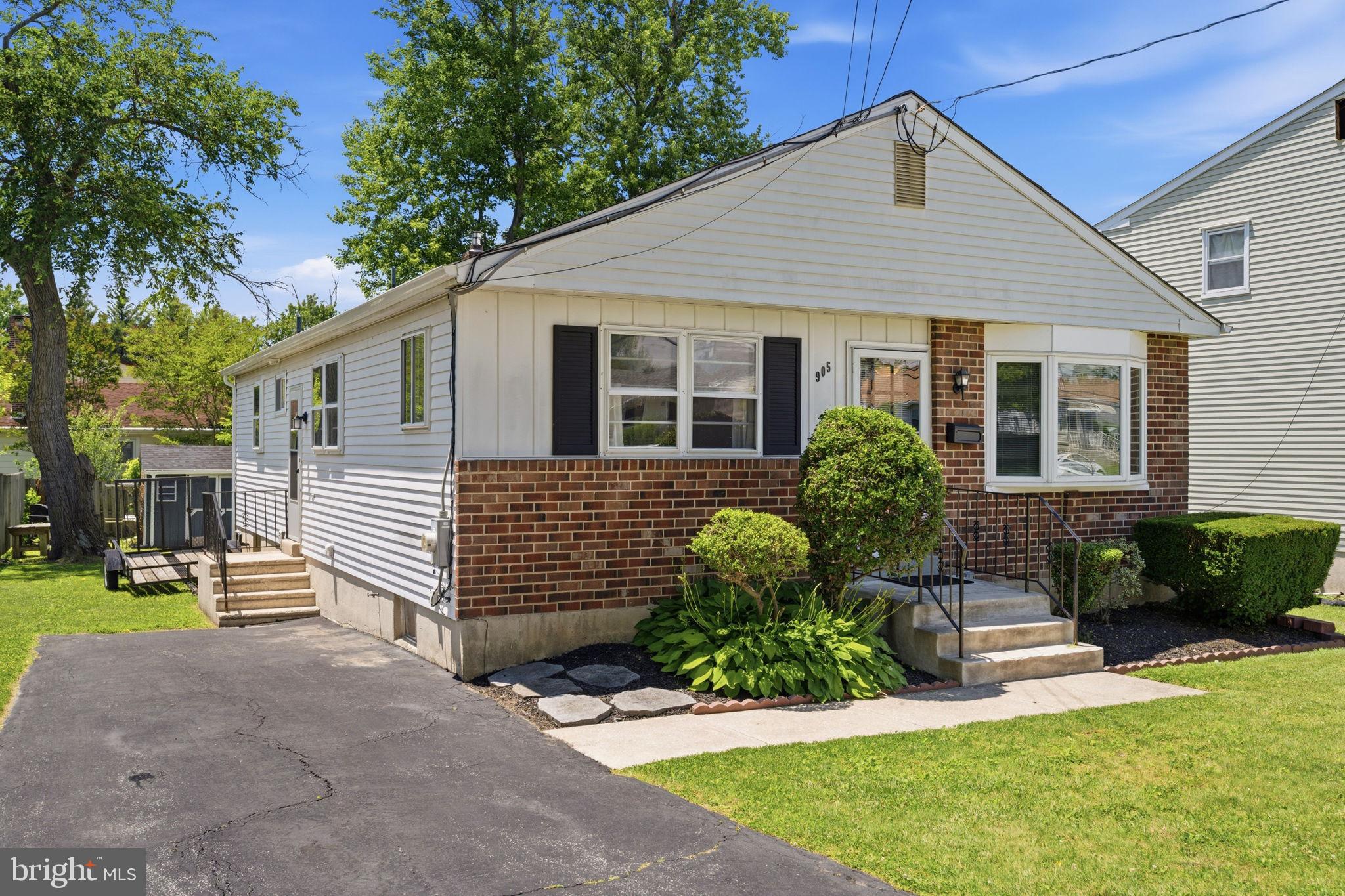 905 Amosland Road Morton, PA 19070 - Photo 5 of 44 Charming home with lush greenery.