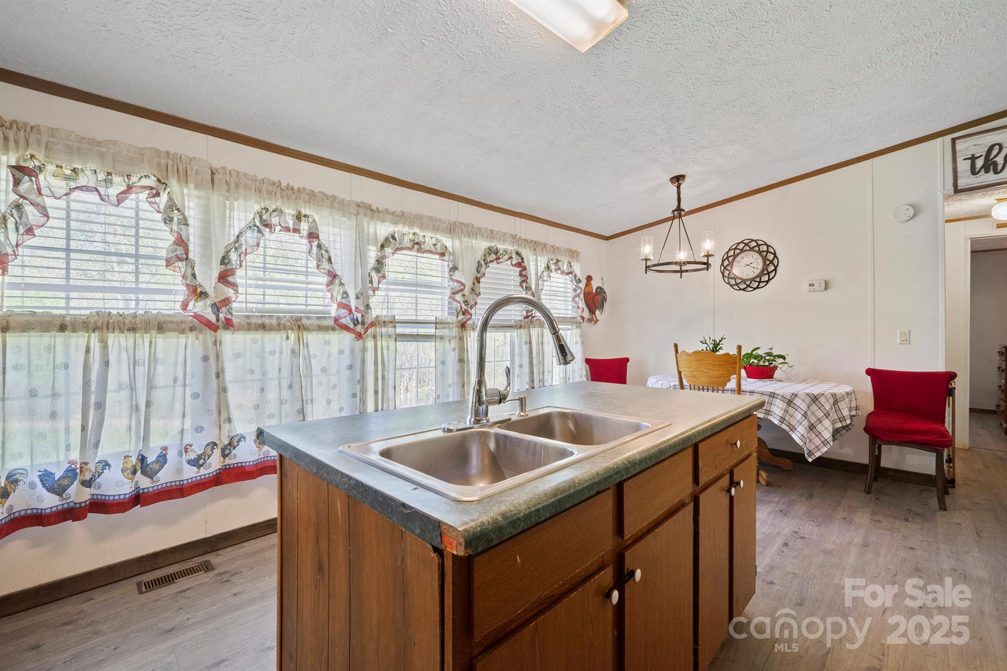6282 Lor Road Morganton, NC 28655 - Photo 11 of 22 a kitchen with a sink and a refrigerator