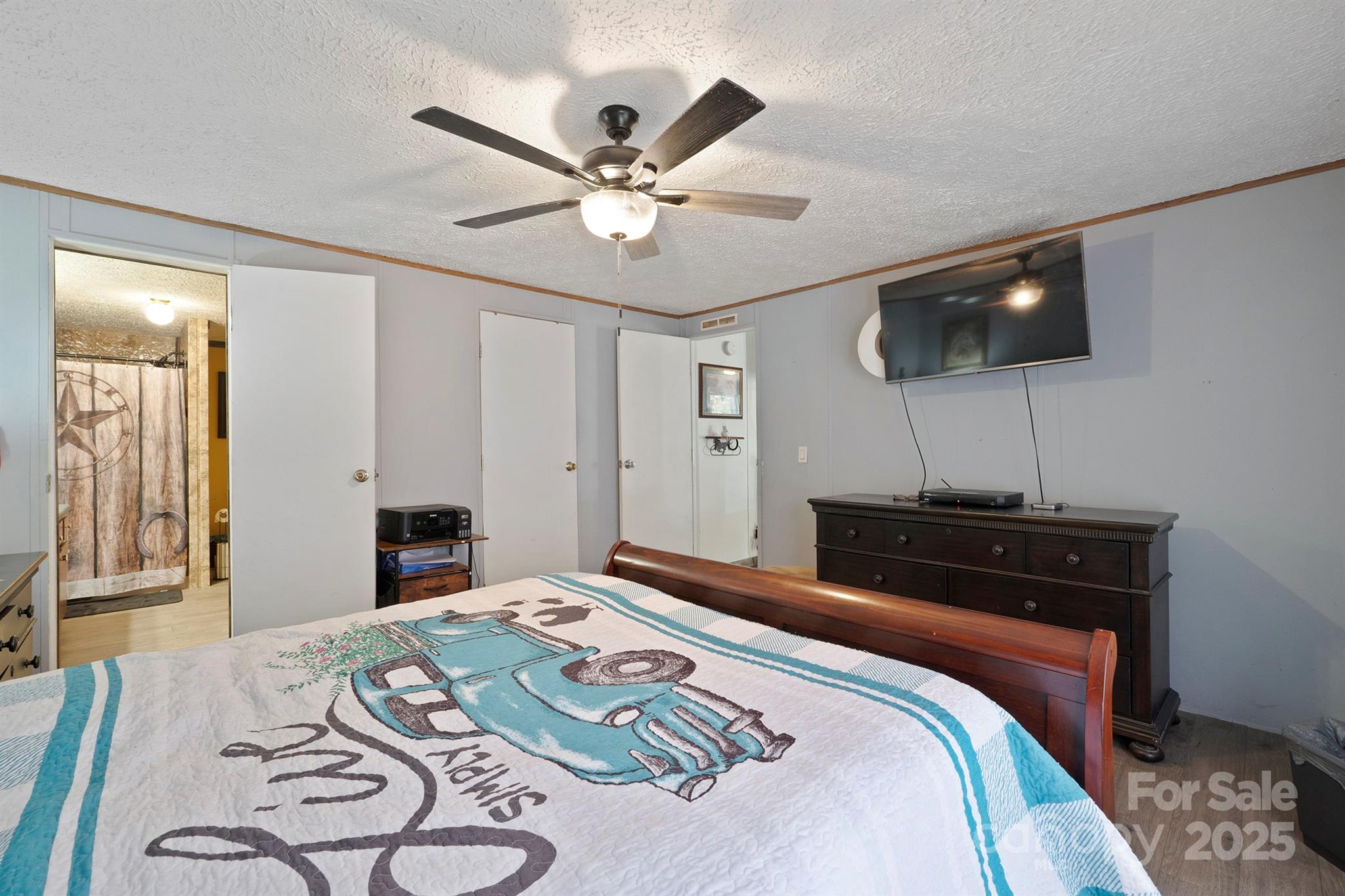 6282 Lor Road Morganton, NC 28655 - Photo 13 of 22 a bedroom with a bed and a chandelier