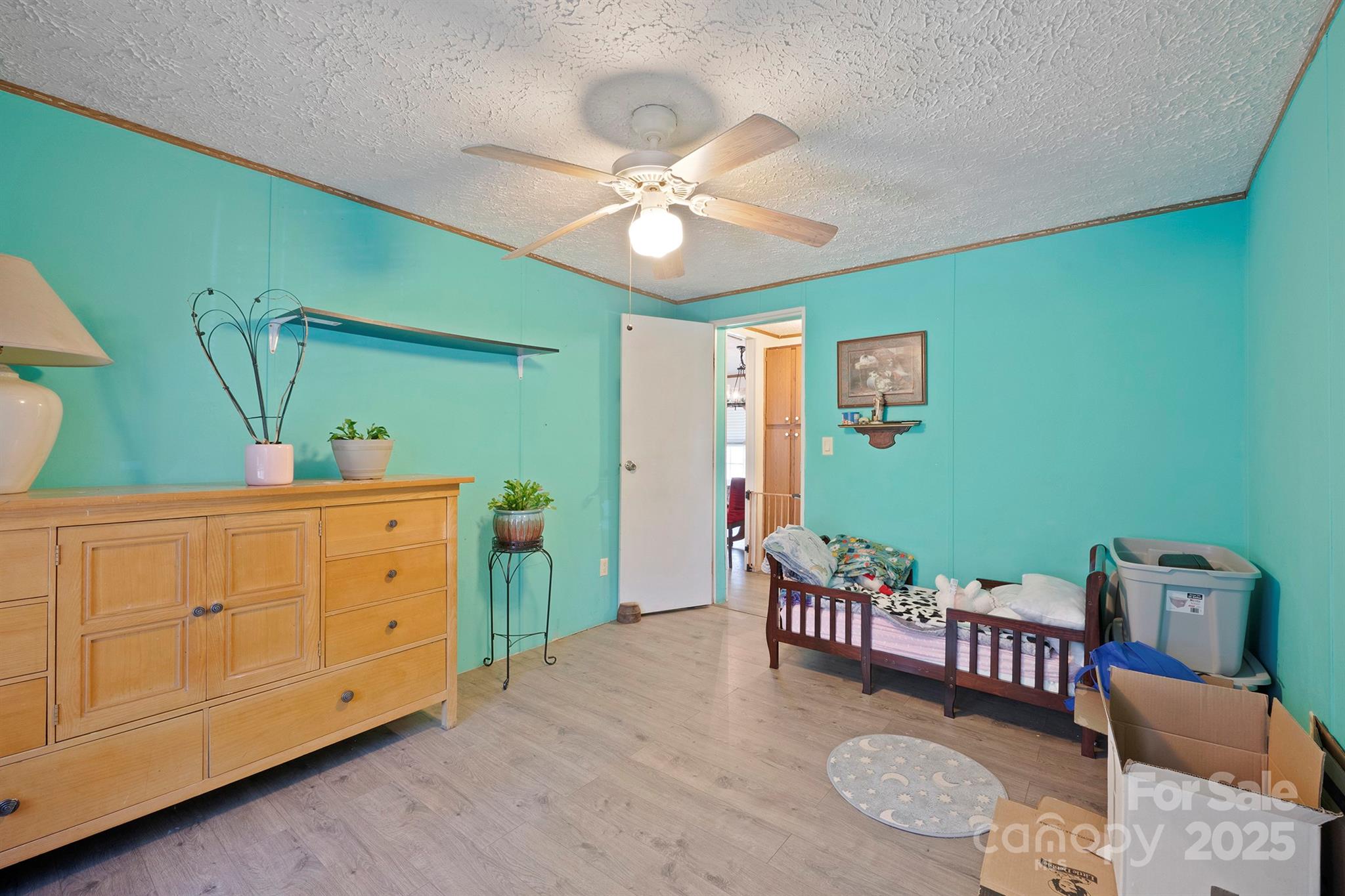 6282 Lor Road Morganton, NC 28655 - Photo 18 of 22 a bedroom with furniture and a chandelier
