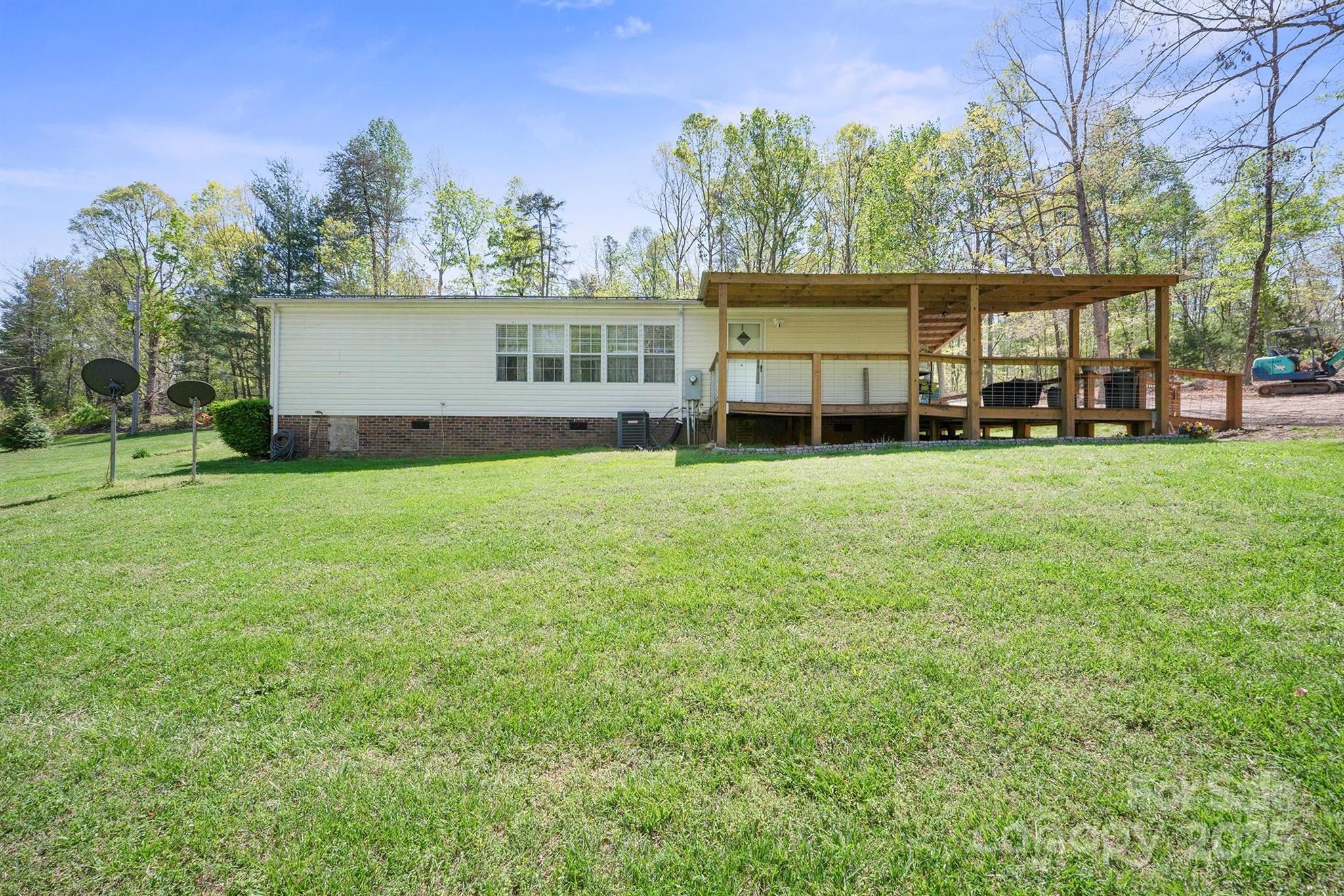 6282 Lor Road Morganton, NC 28655 - Photo 21 of 22 a view of a house with a yard and sitting area