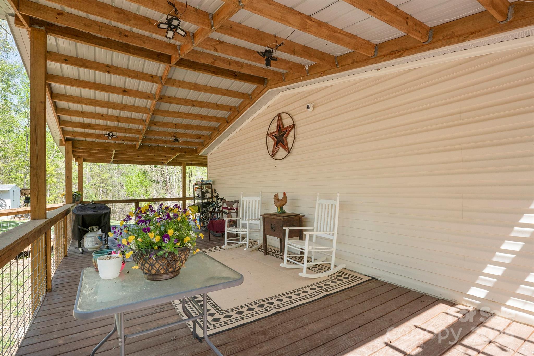 6282 Lor Road Morganton, NC 28655 - Photo 4 of 22 a view of a dining room with furniture and a potted plant