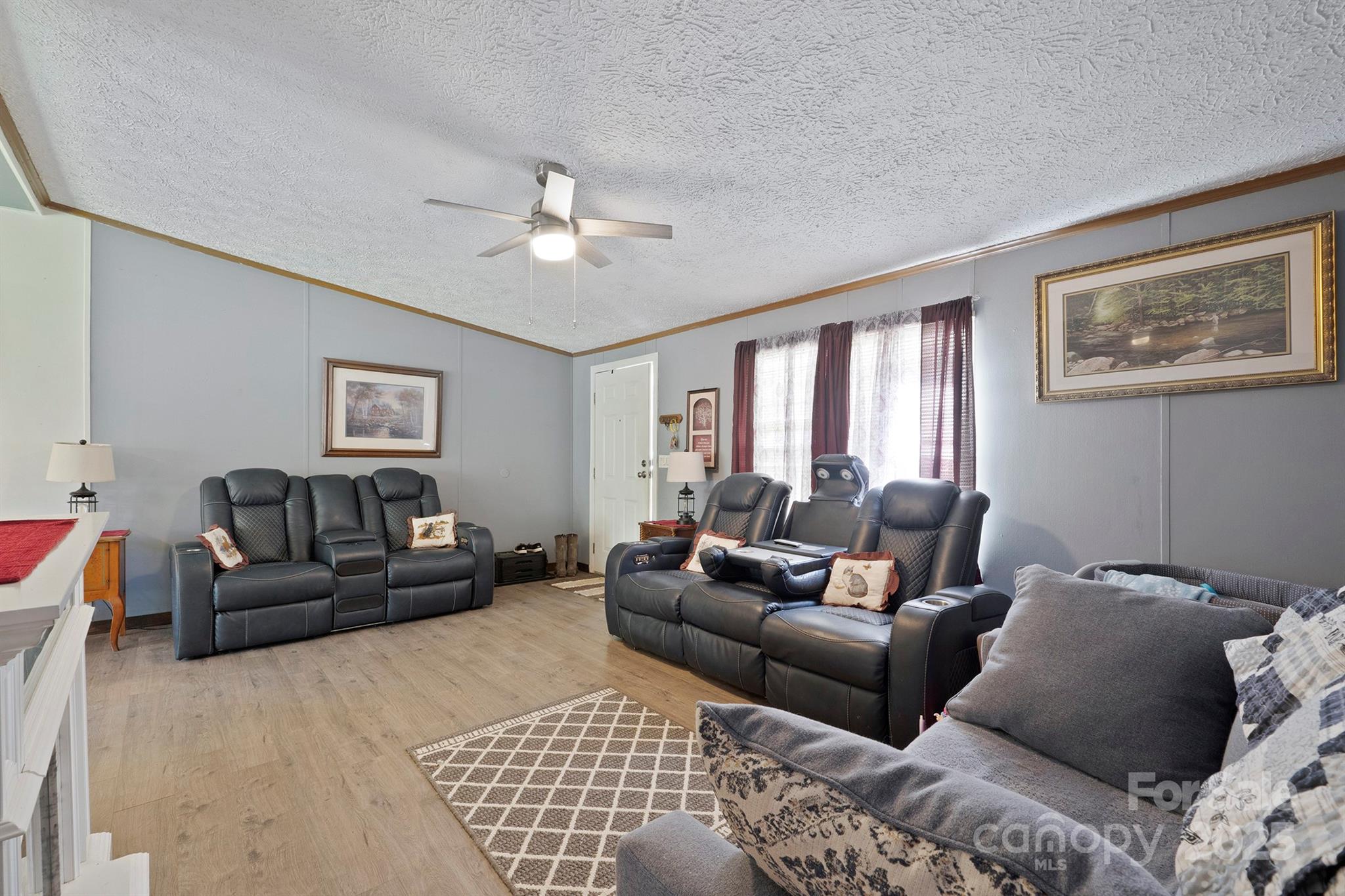 6282 Lor Road Morganton, NC 28655 - Photo 6 of 22 a living room with furniture ceiling fan and a window