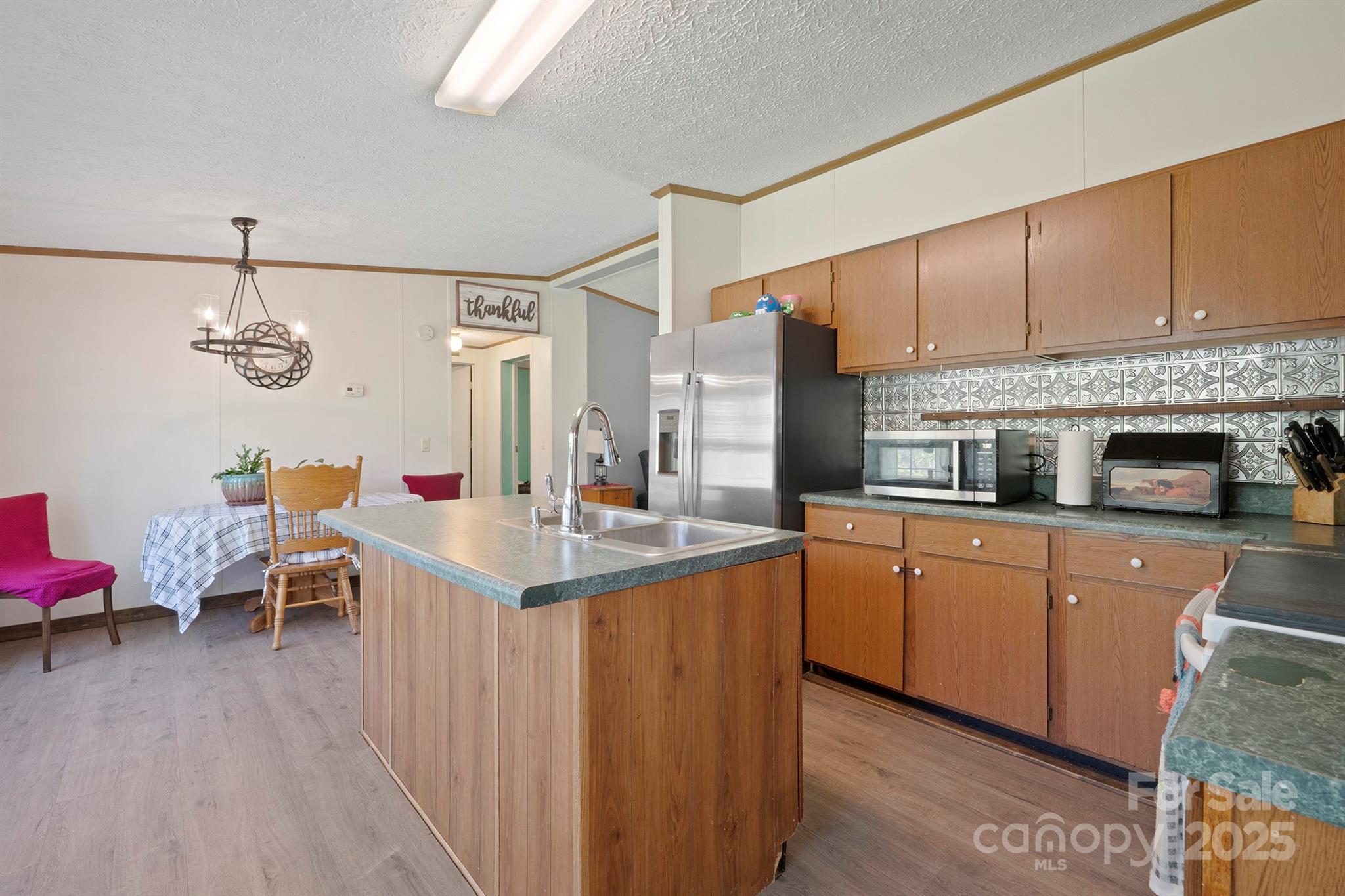 6282 Lor Road Morganton, NC 28655 - Photo 10 of 22 a kitchen with a sink appliances and cabinets
