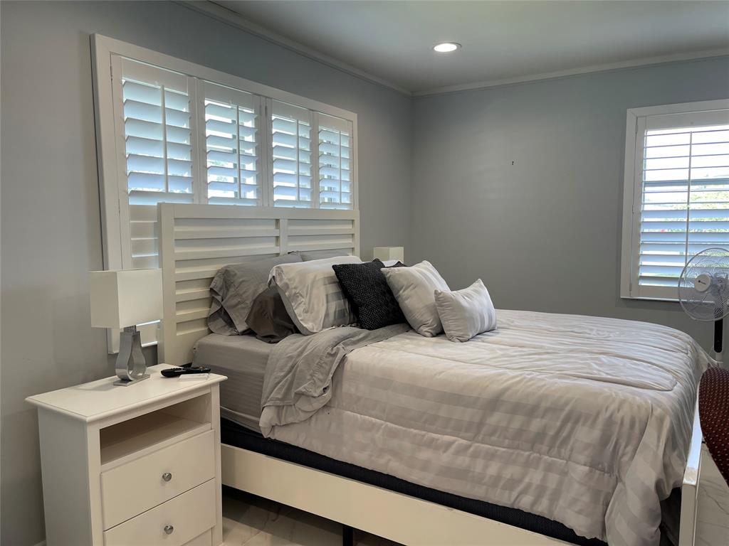 5388 Privet Place, Unit A Delray Beach, FL 33484 - Photo 11 of 33 a bedroom with a bed and a window