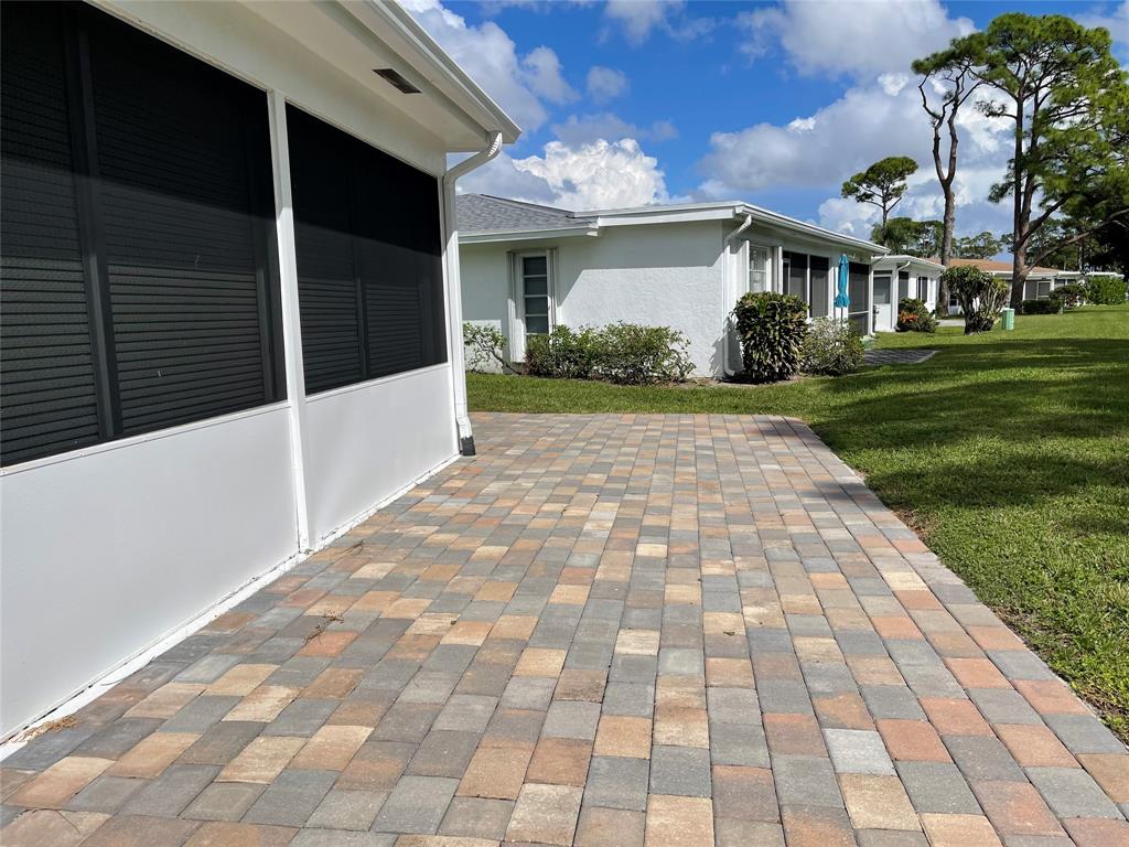 5388 Privet Place, Unit A Delray Beach, FL 33484 - Photo 16 of 33 a view of a white house with a yard