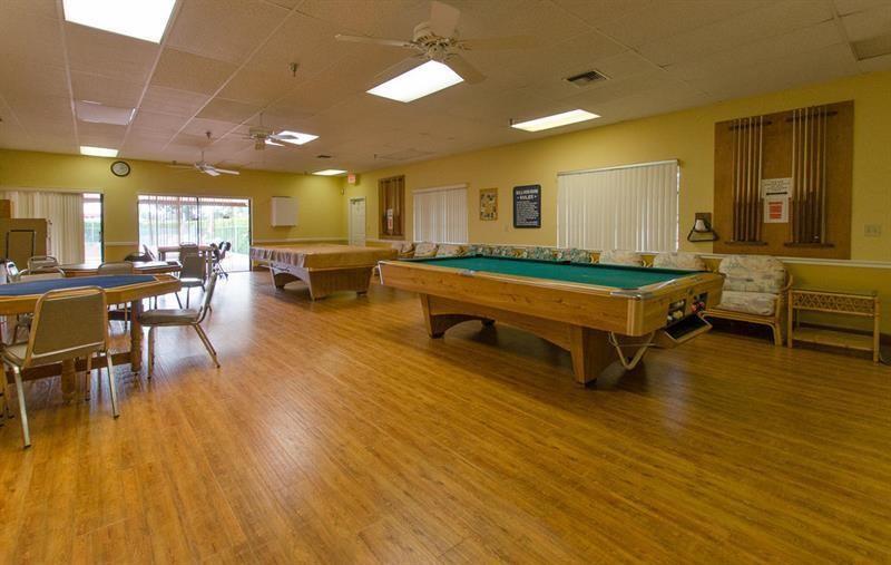 5388 Privet Place, Unit A Delray Beach, FL 33484 - Photo 23 of 33 a room with wooden floor and pool table