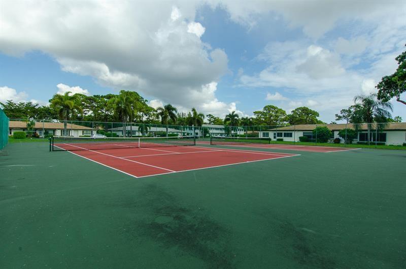 5388 Privet Place, Unit A Delray Beach, FL 33484 - Photo 28 of 33 a view of tennis court