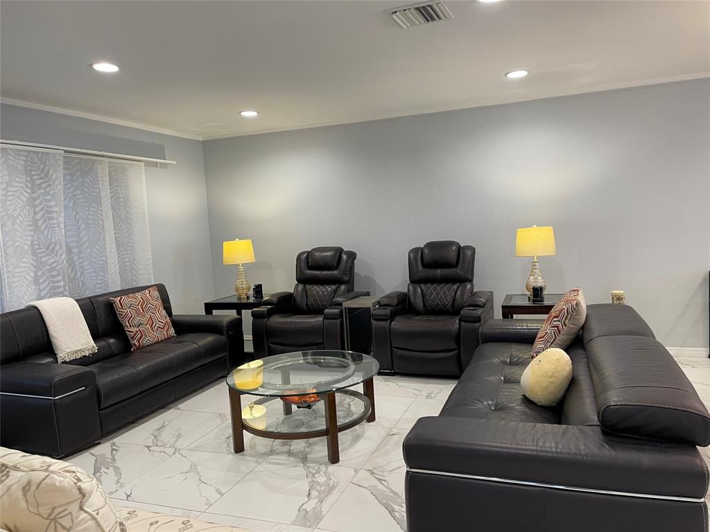 5388 Privet Place, Unit A Delray Beach, FL 33484 - Photo 5 of 33 a living room with furniture and a lamp