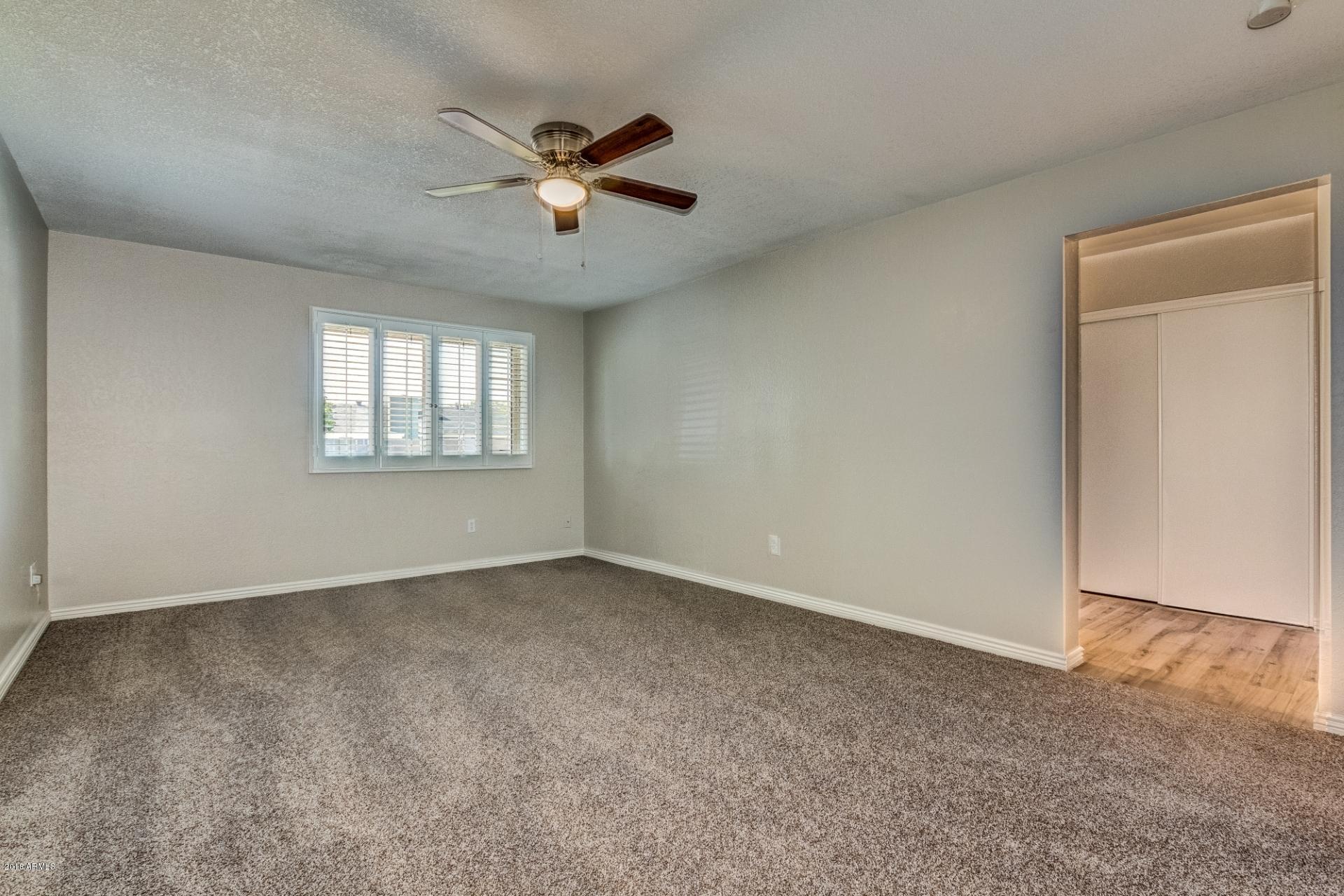 4833 East Kathleen Road Scottsdale, AZ 85254 - Photo 16 of 21 a view of an empty room with a window