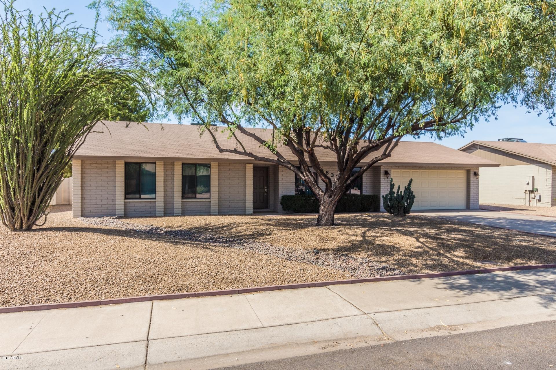 4833 East Kathleen Road Scottsdale, AZ 85254 - Photo 2 of 21 a front view of a house with a garden