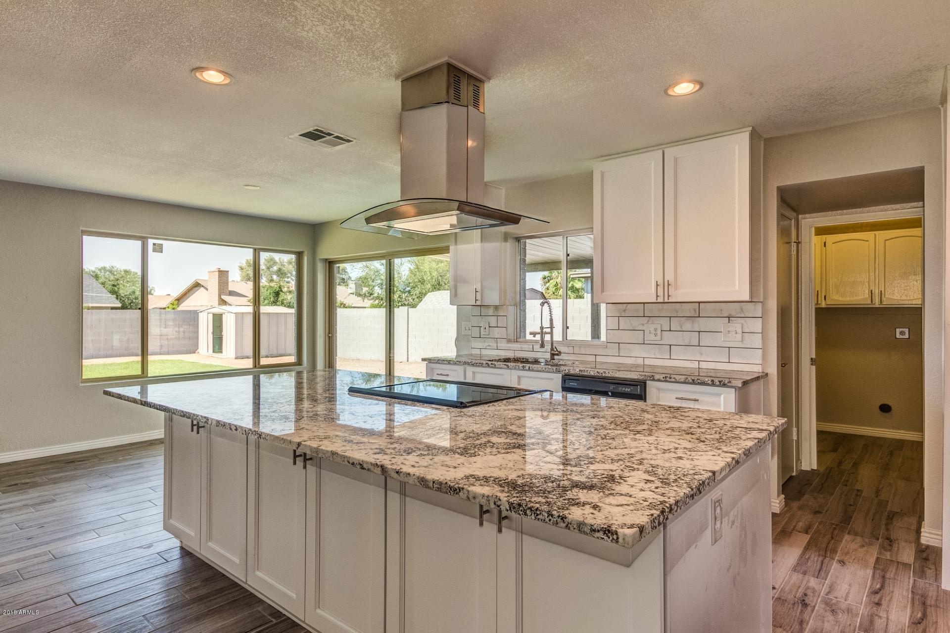 4833 East Kathleen Road Scottsdale, AZ 85254 - Photo 5 of 21 a kitchen with counter top space and windows