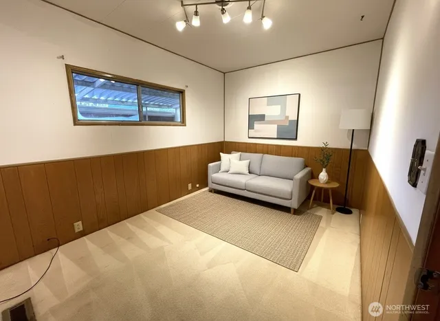 a bathroom with a sink a toilet a mirror and shower