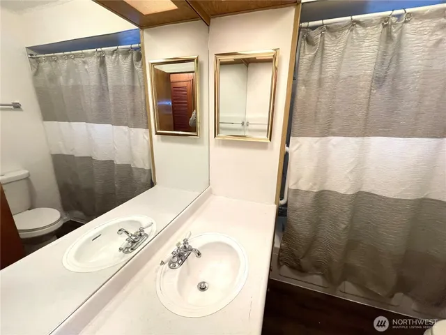 a view of hallway with wooden floor