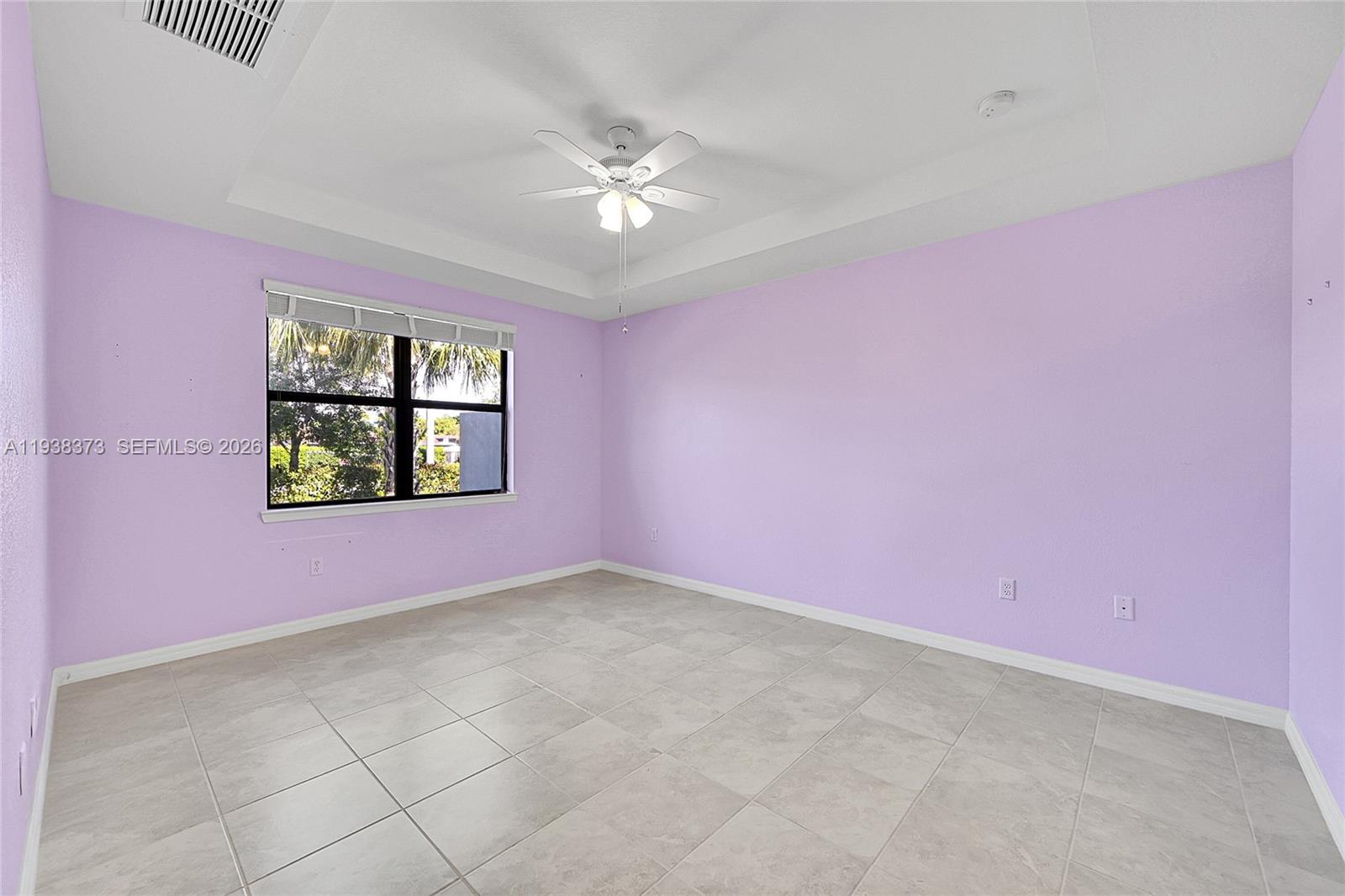9145 Passiflora Way Boca Raton, FL 33428 - Photo 12 of 54 a view of an empty room with a window