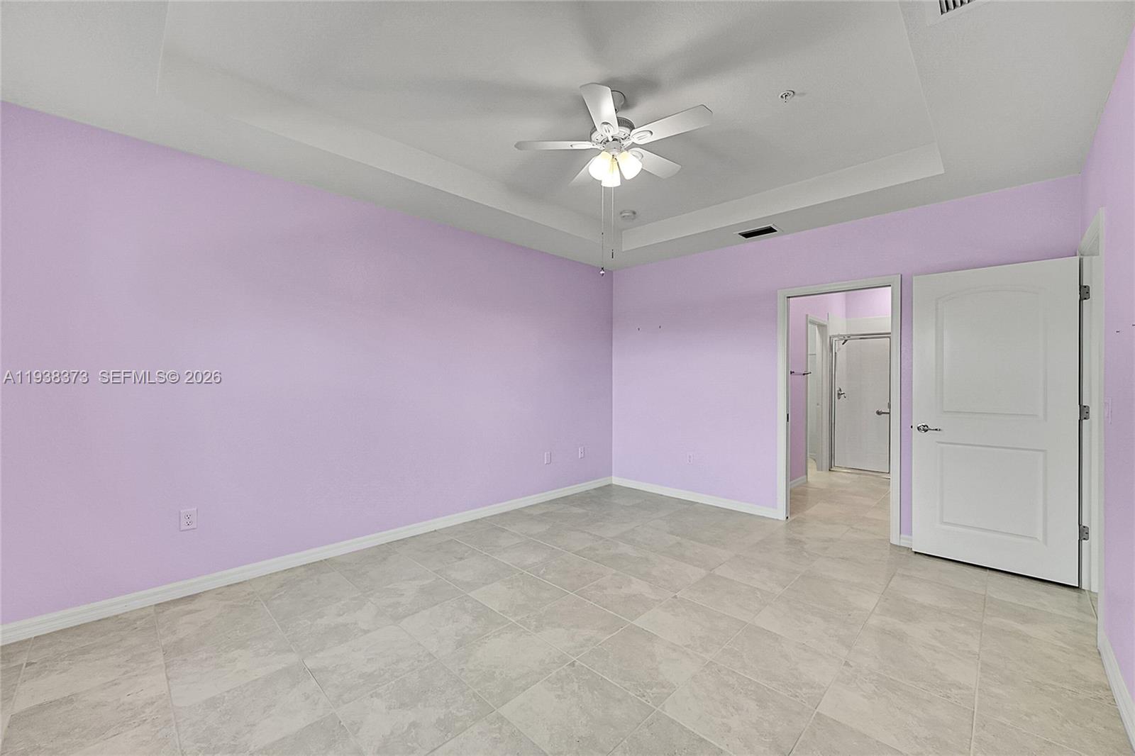 9145 Passiflora Way Boca Raton, FL 33428 - Photo 13 of 54 a view of an empty room with chandelier fan