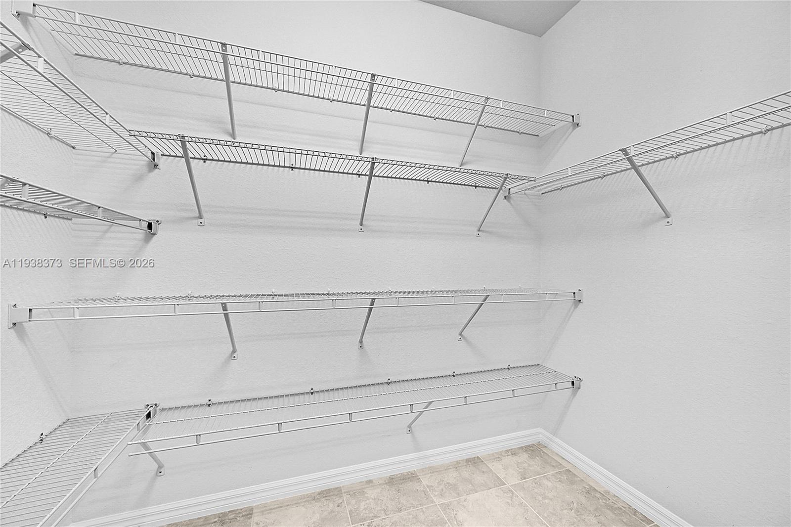 9145 Passiflora Way Boca Raton, FL 33428 - Photo 18 of 54 a view of a room with racks on the wall