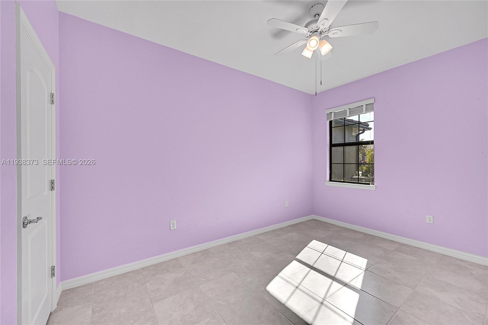 9145 Passiflora Way Boca Raton, FL 33428 - Photo 22 of 54 an empty room with windows and fan