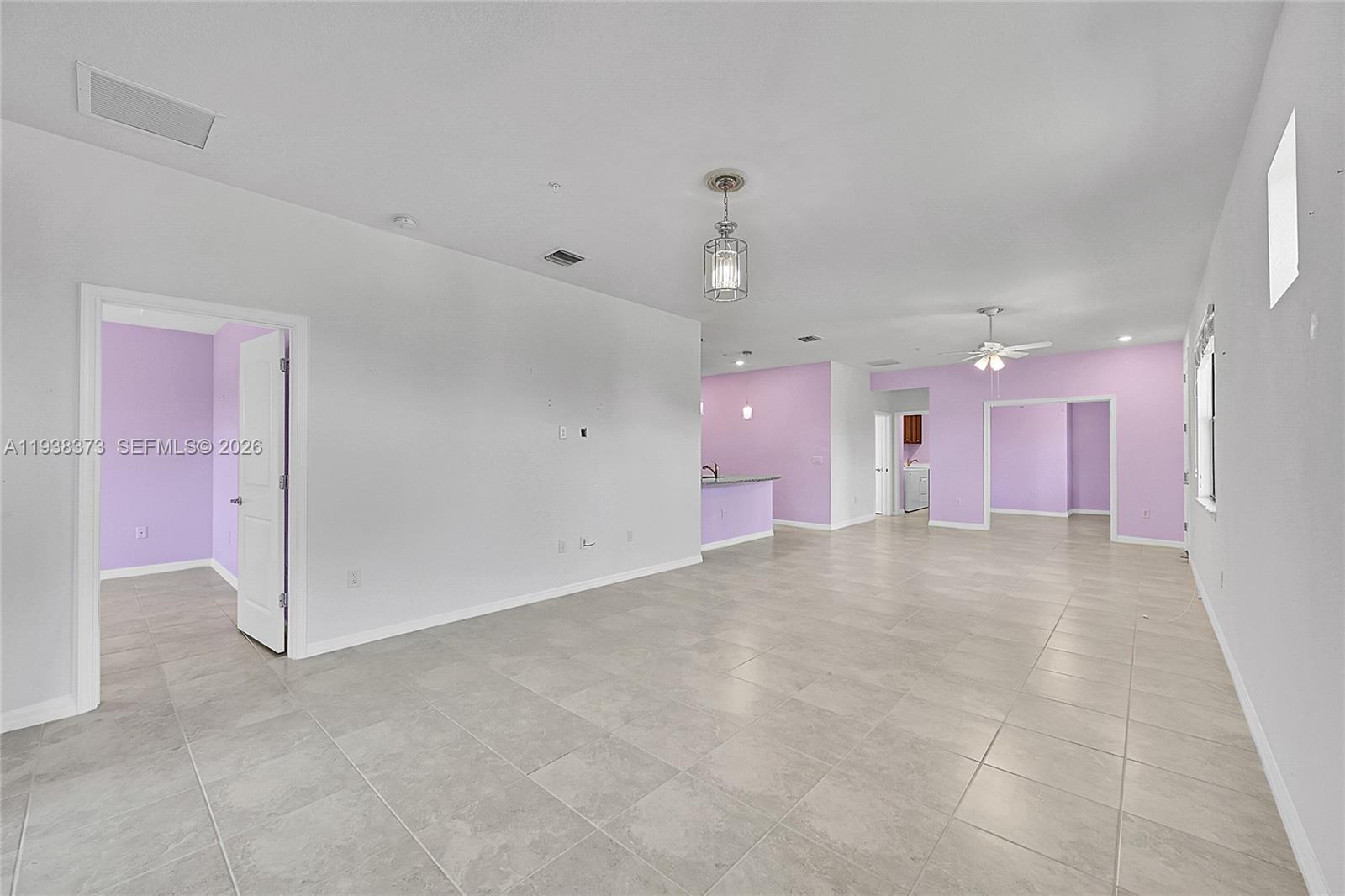 9145 Passiflora Way Boca Raton, FL 33428 - Photo 5 of 54 a view of a room with kitchen and a window