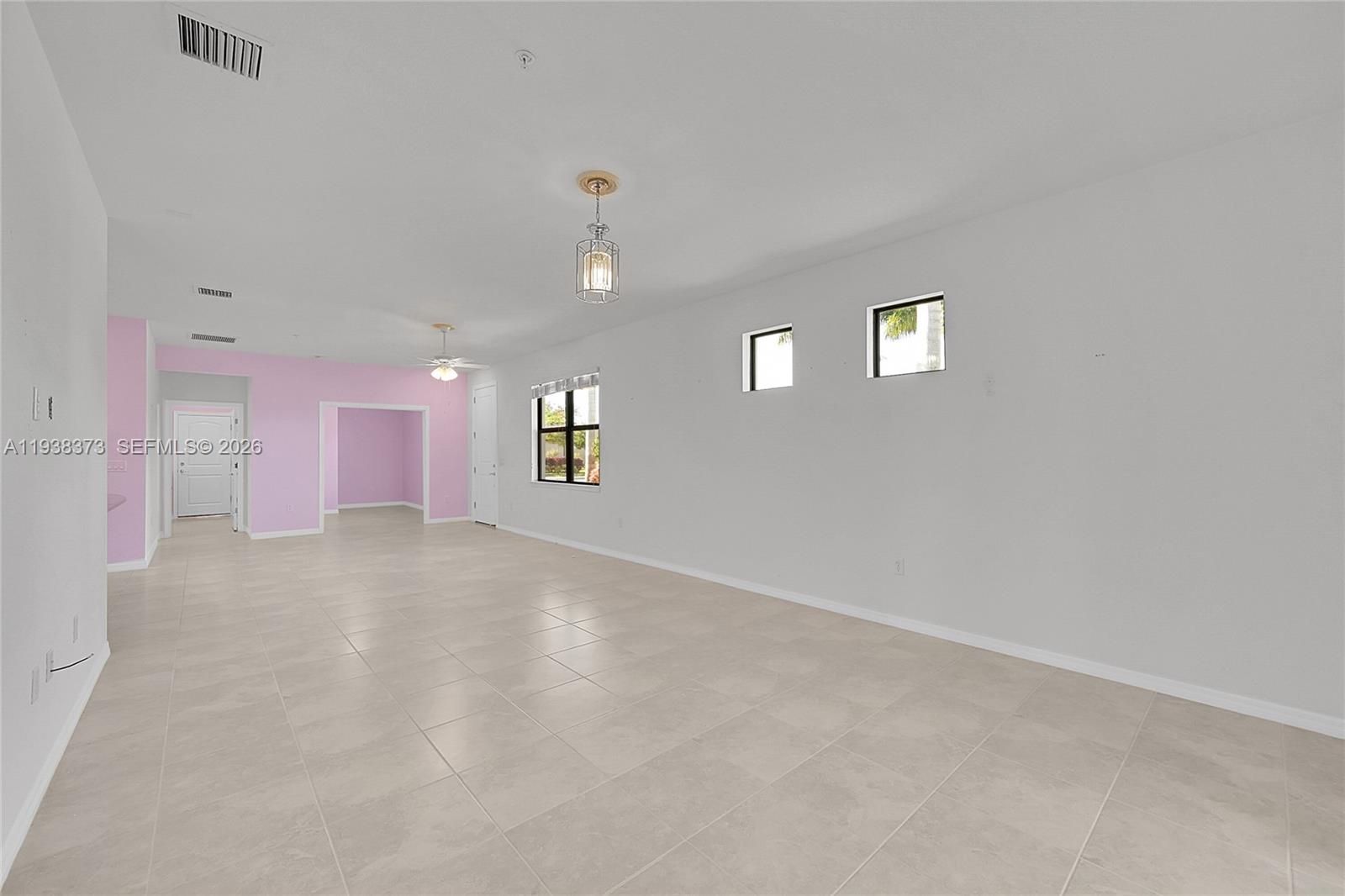 9145 Passiflora Way Boca Raton, FL 33428 - Photo 6 of 54 a view of a livingroom and a empty room