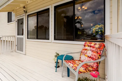 a view of a balcony with wooden floor