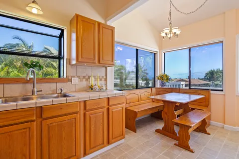 a very nice looking kitchen with a large window