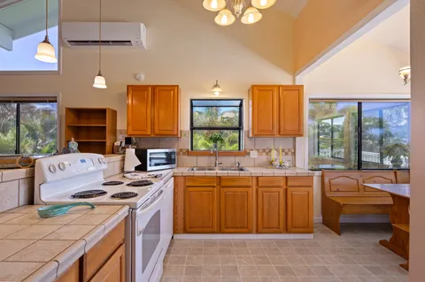 a kitchen that has a sink and a stove in it