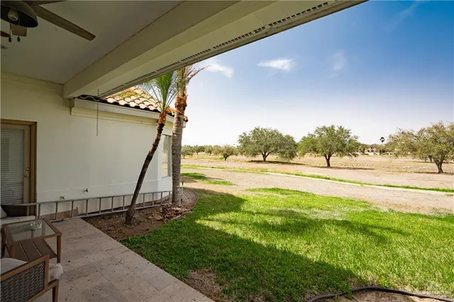 a view of a swimming pool with an outdoor seating