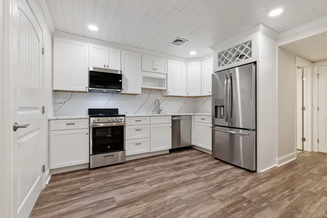 a view of a livingroom with wooden floor