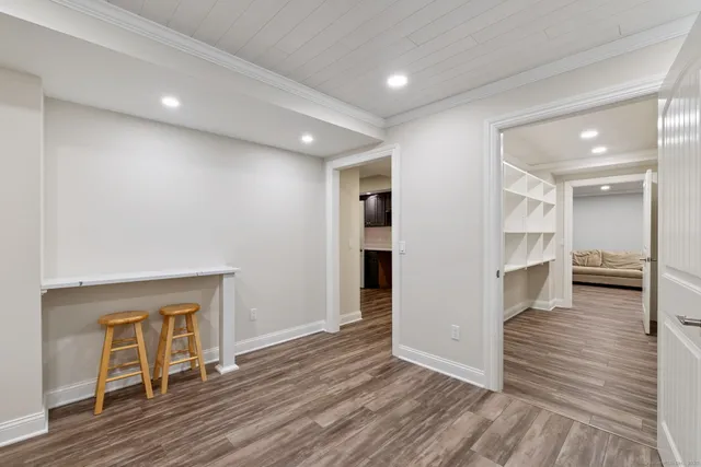 a spacious bedroom with a bed and a couch