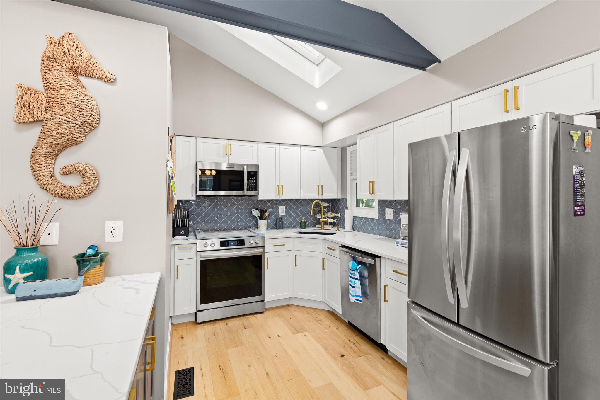 4 Haven End Ocean Pines, MD 21811 - Photo 12 of 37 a kitchen with stainless steel appliances granite countertop a refrigerator sink and stove