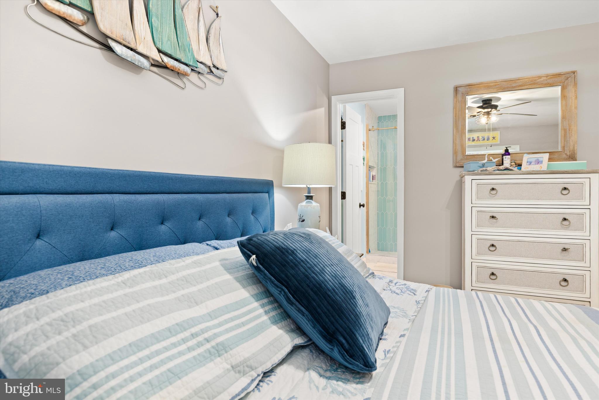 4 Haven End Ocean Pines, MD 21811 - Photo 16 of 37 a bedroom with a bed and a dresser