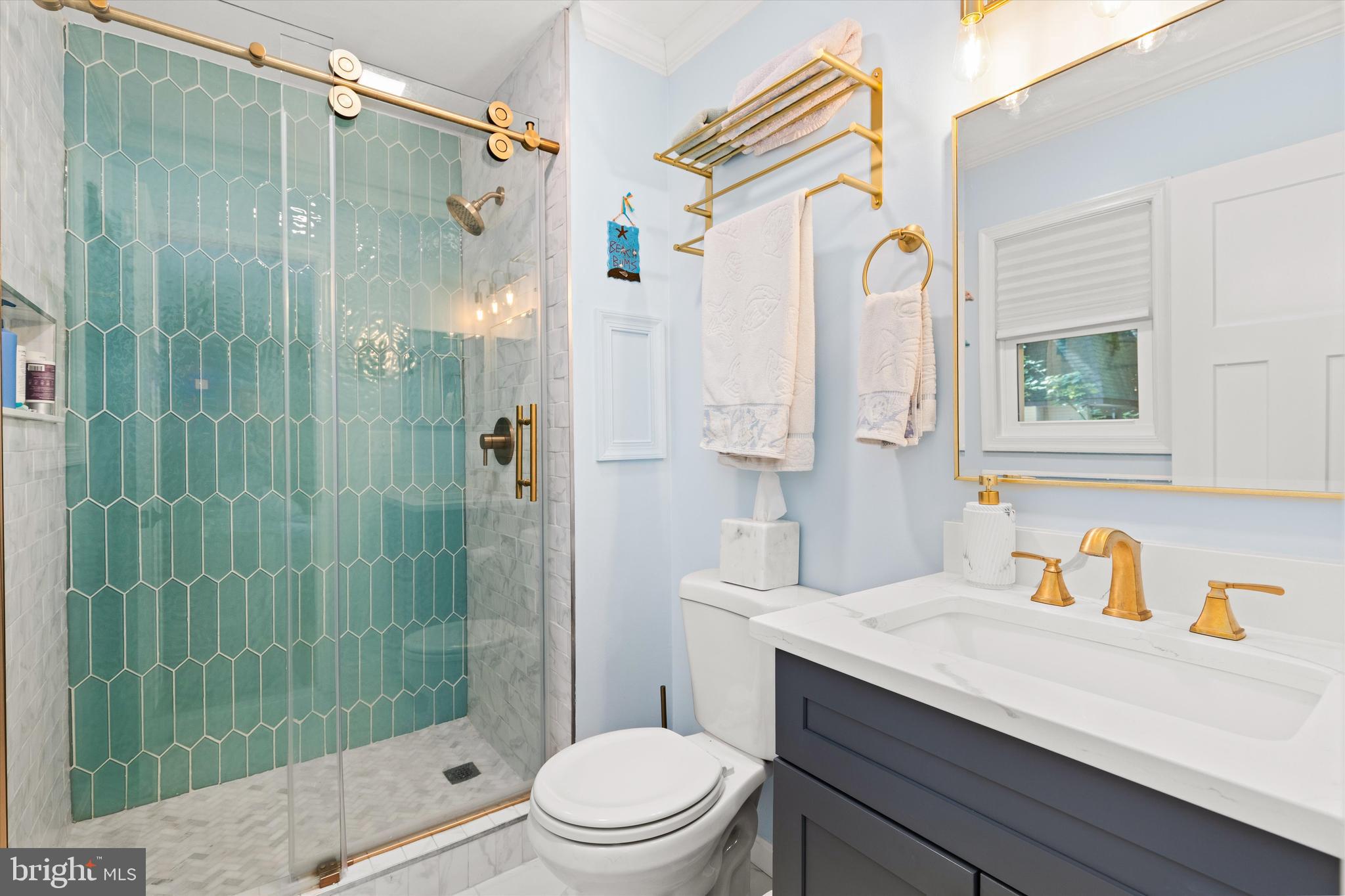 4 Haven End Ocean Pines, MD 21811 - Photo 17 of 37 a bathroom with a sink a toilet and shower