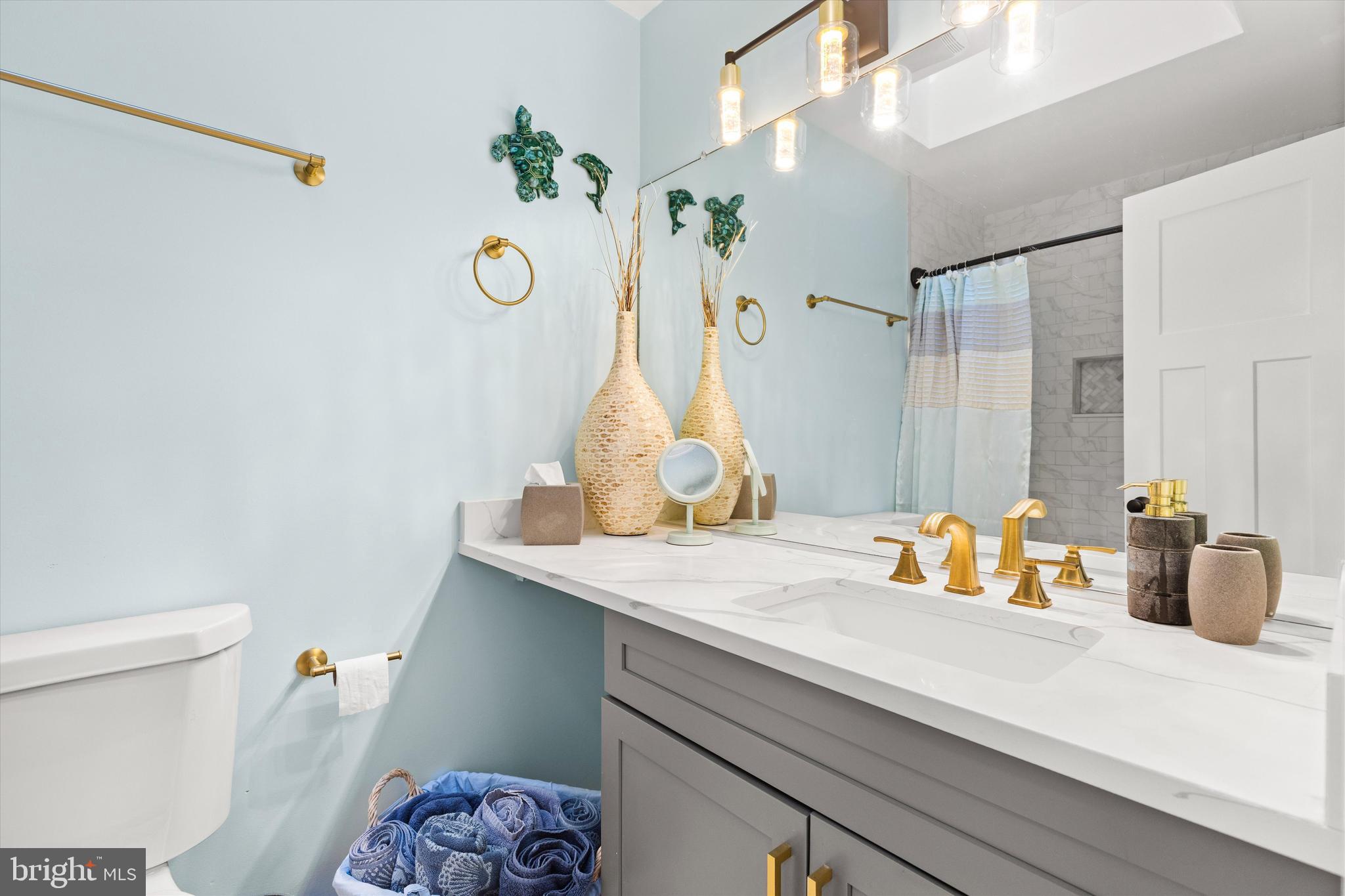 4 Haven End Ocean Pines, MD 21811 - Photo 24 of 37 a bathroom with a sink and a mirror