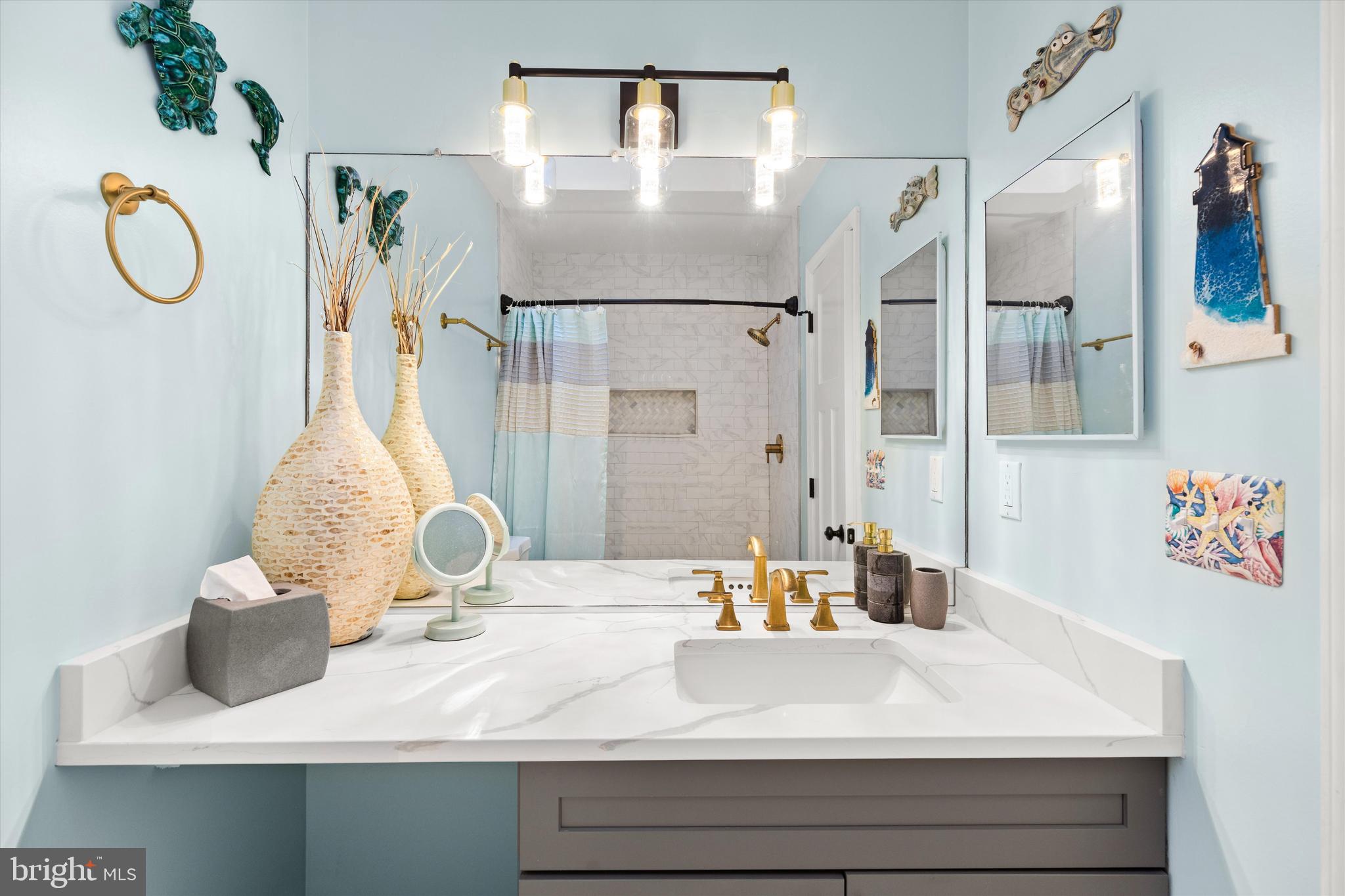 4 Haven End Ocean Pines, MD 21811 - Photo 25 of 37 a bathroom with a sink and a mirror