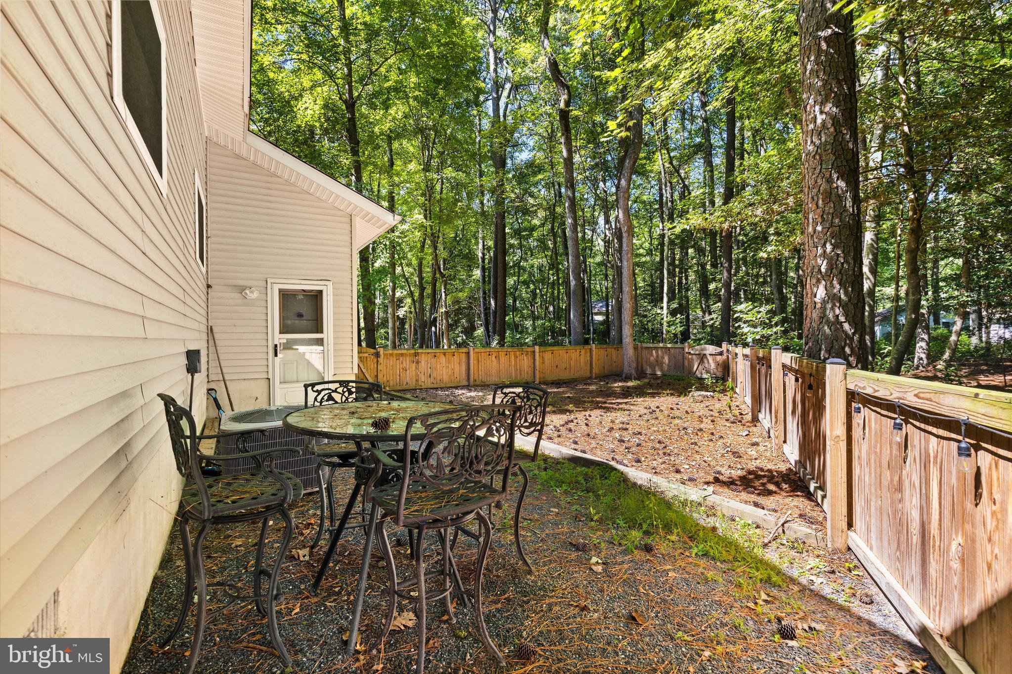 4 Haven End Ocean Pines, MD 21811 - Photo 31 of 37 a view of a patio with table and chairs and wooden floor