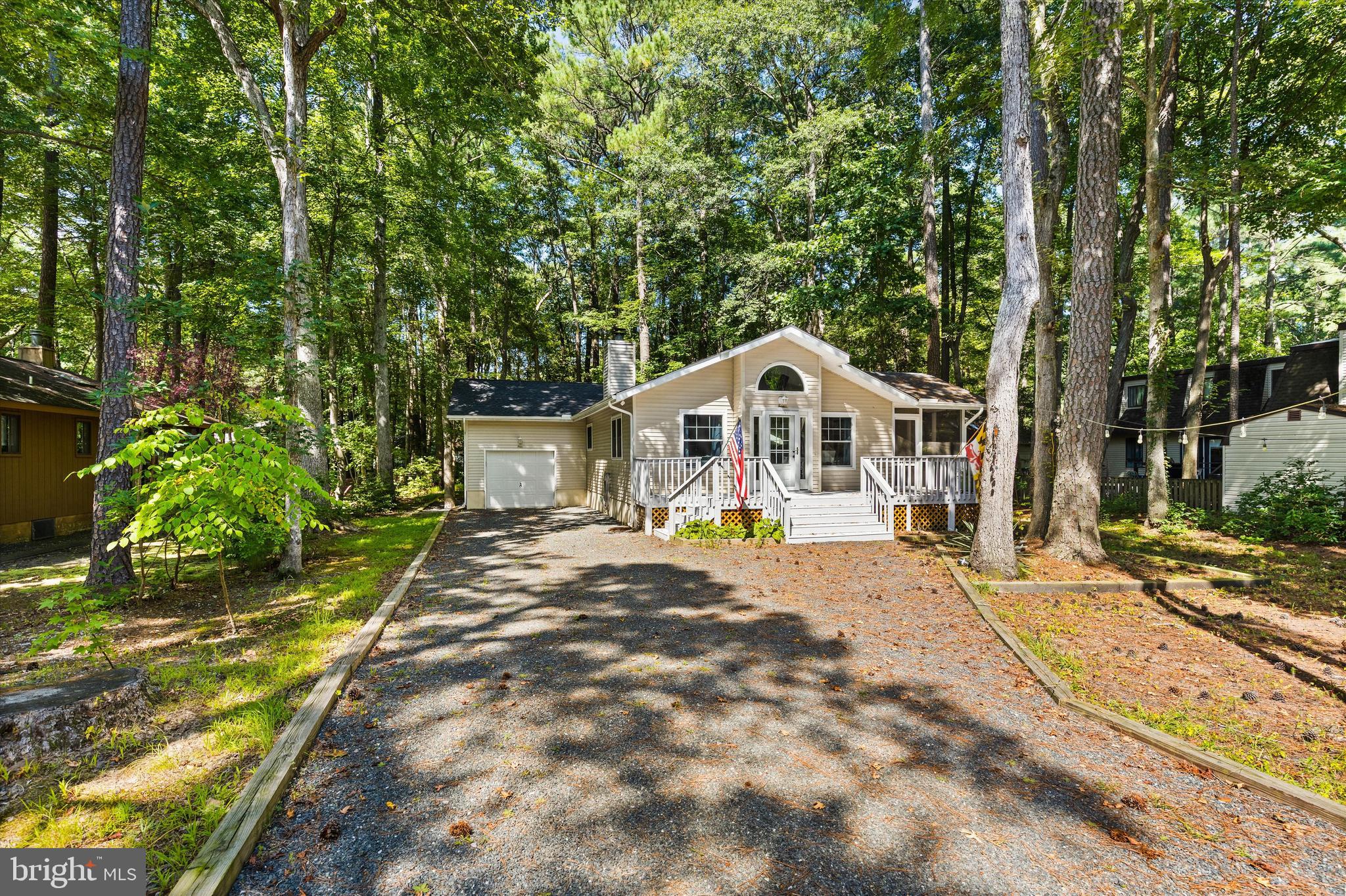 4 Haven End Ocean Pines, MD 21811 - Photo 4 of 37 a front view of a house with garden